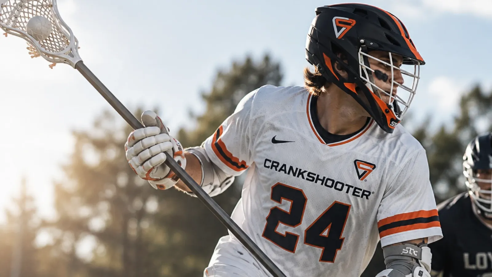 Crankshooter lacrosse player cradling the ball during a game